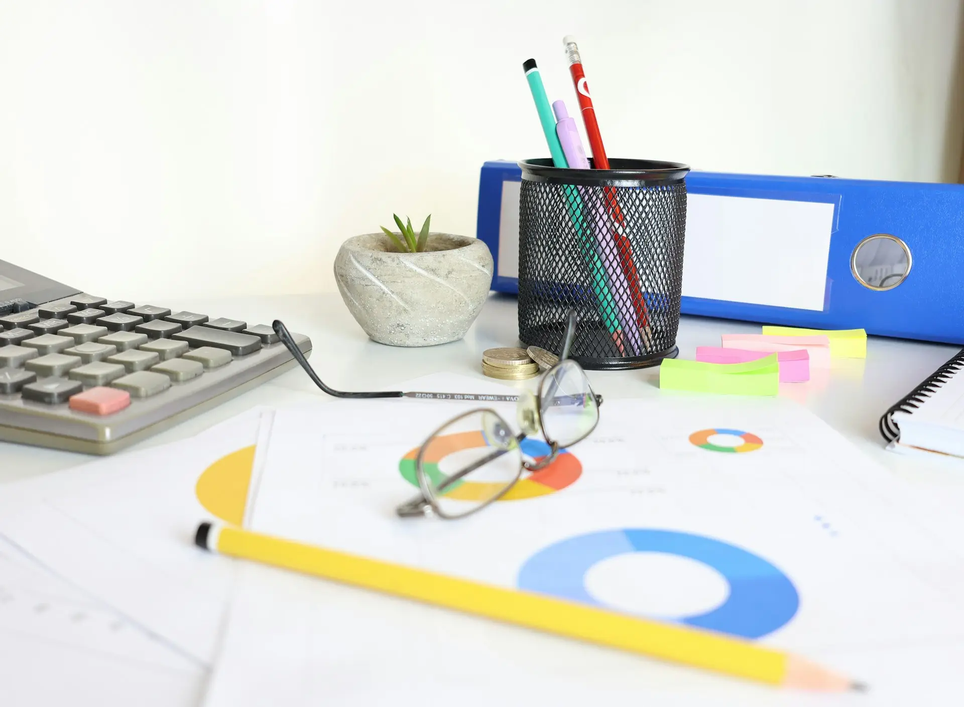 Charts and research notes laid out on a desk